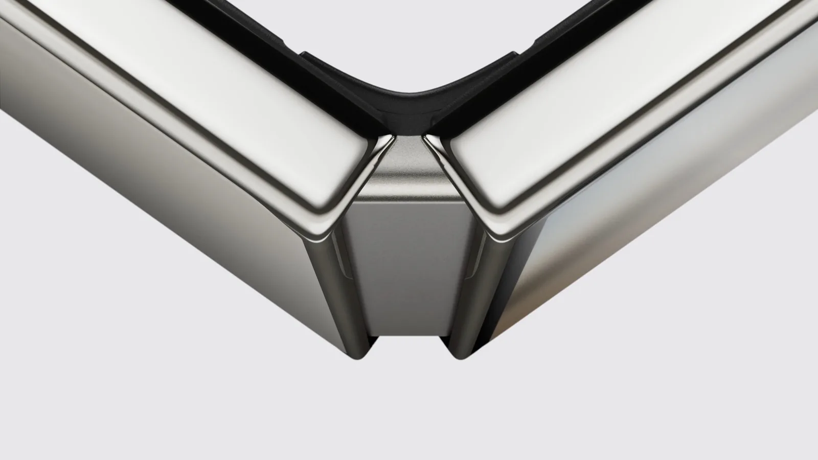 A close-up of the iPhone Duo hinge, the phone partly open and seen from its spine