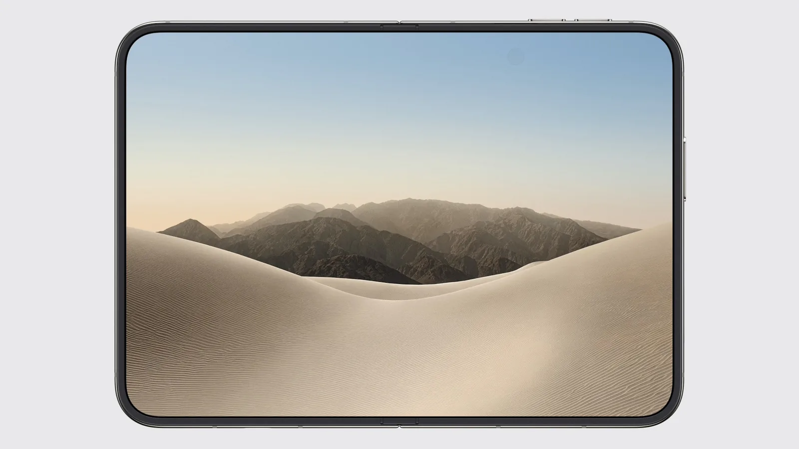 iPhone Duo open flat, a desert landscape filling the 7.6-inch inner display from edge to edge